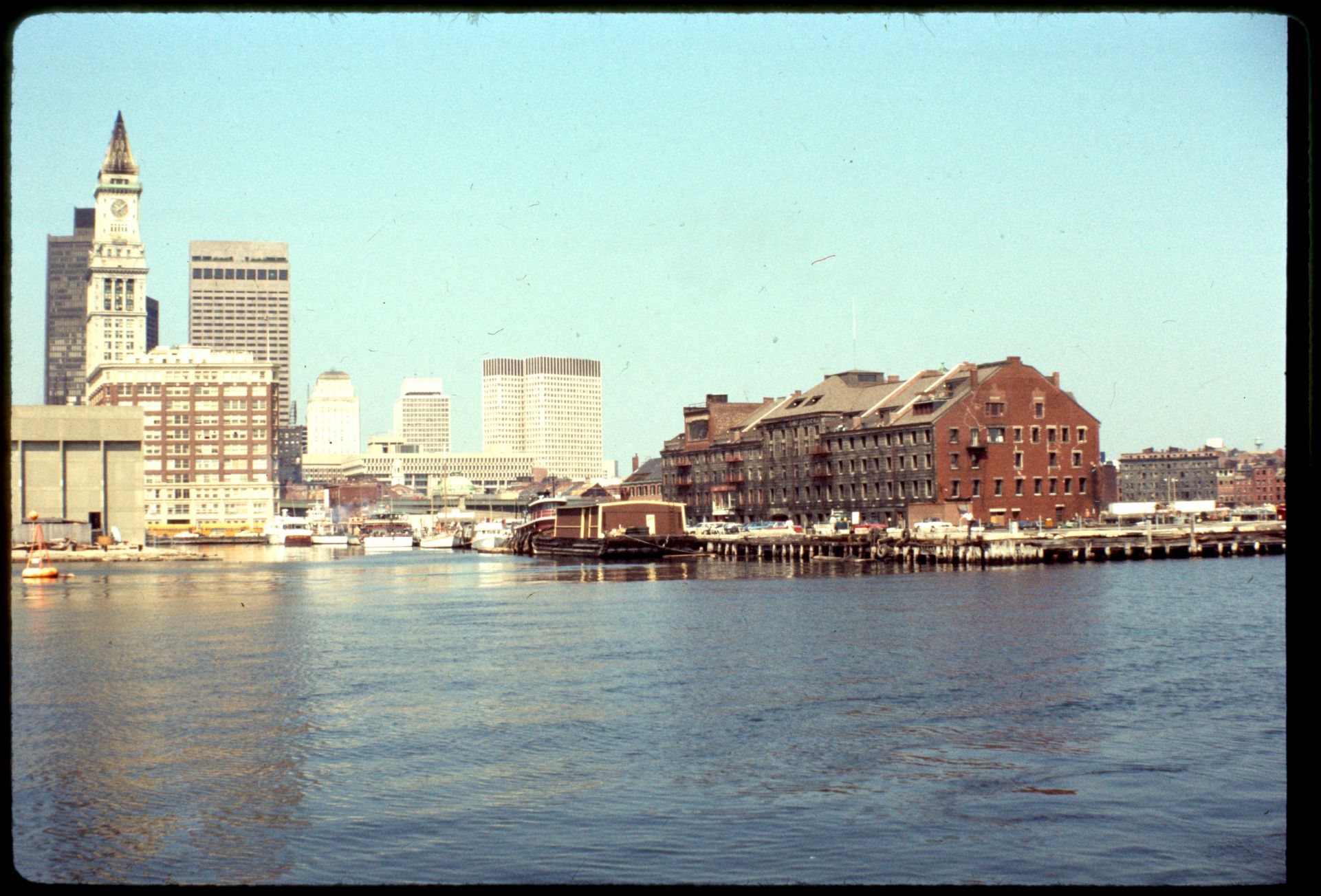 1973 photograph of Long Wharf, with Chart House visible across from the Custom House Tower and the newly built New England Aquarium