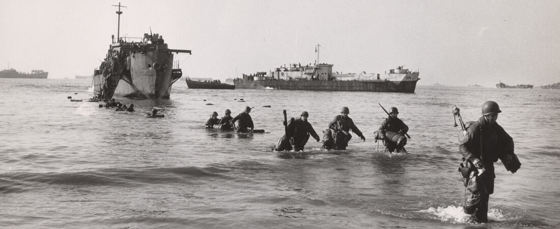 Fifth Army troops wading ashore from LCIs at the new Fifth Army beachhead near Anzio, Italy