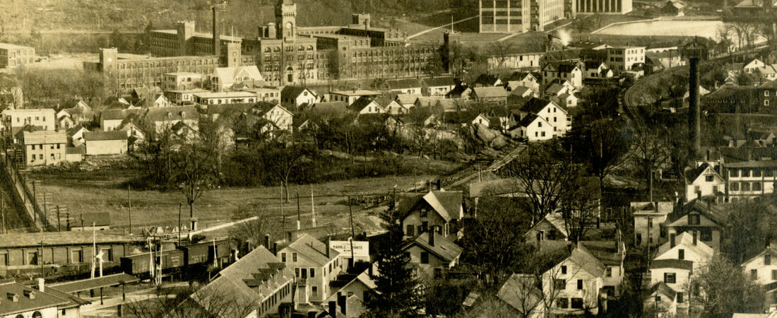 Aerial view of town of Southbridge, MA and the American Optical Company from Notre Dame Church during construction